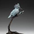 Photo of bronze sculpture of king fisher on branch next to dragon fly with granite base