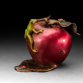 Photo of small bronze Sculpture featuring Tree Frog on two-toned apple with several insects