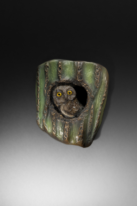 Photo of wall mount bronze sculpture of Elf Owl in a cactus