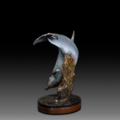 Photo of bronze Sculpture featuring Bottle Nose Dolphin with light blue patina on turntable base