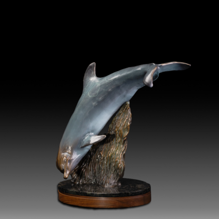 Photo of bronze Sculpture featuring Bottle Nose Dolphin with light blue patina on turntable base