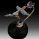 Bronze sculpture of humming bird feeding on a flower